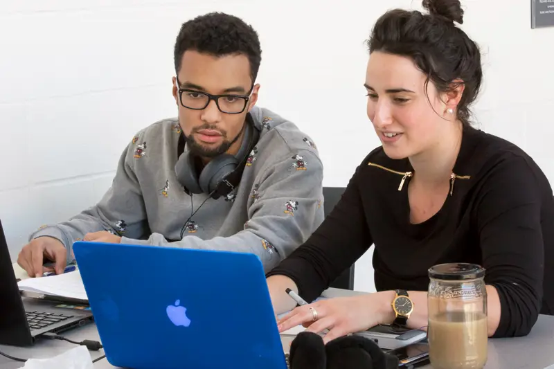 Two students looking at a computer